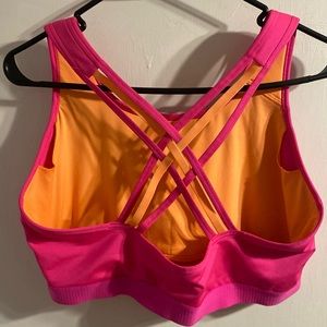 AVIA sports bra. Never worn. Bright colors and fun strap detail